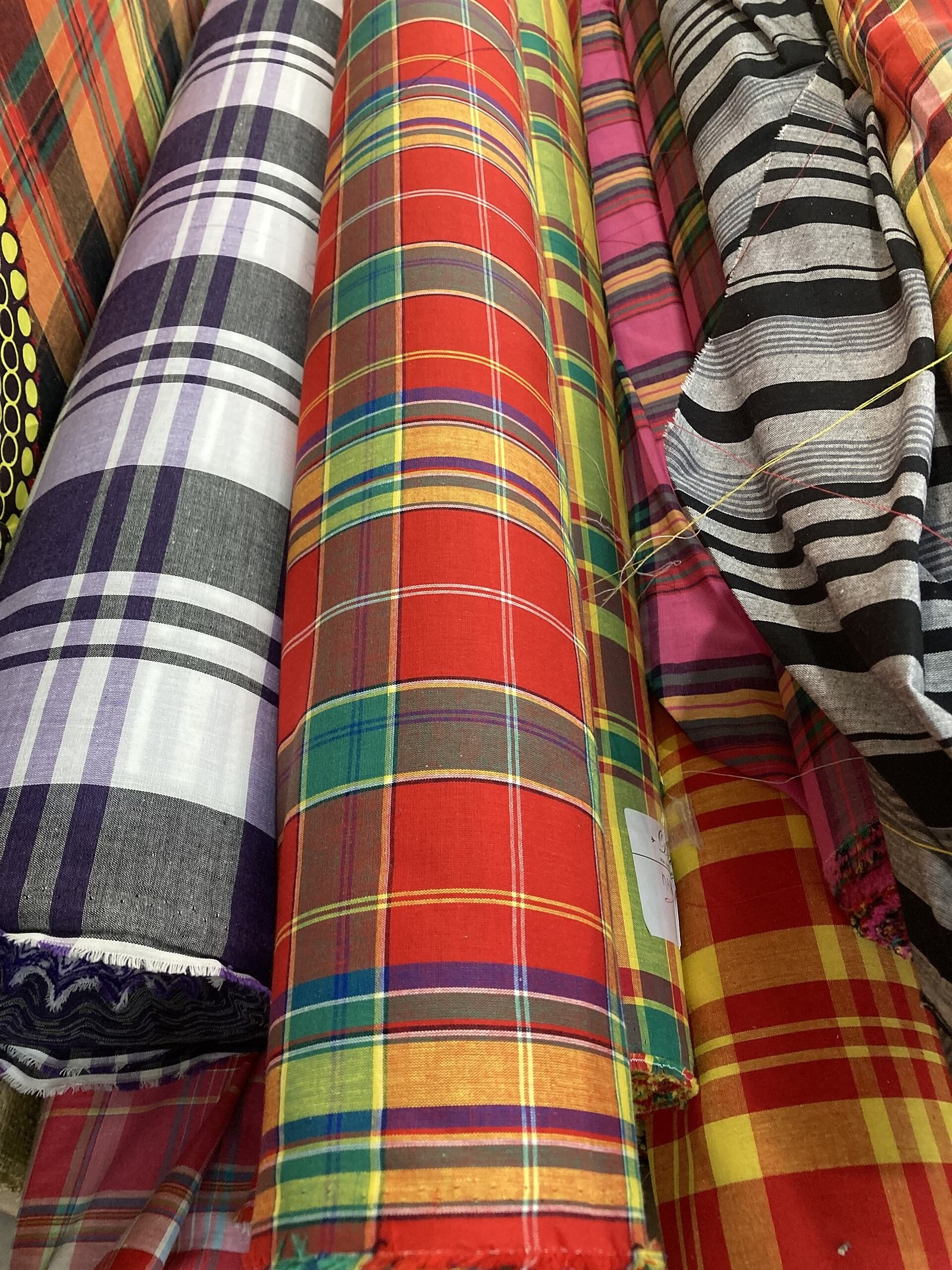 Rolls of checked and striped fabric